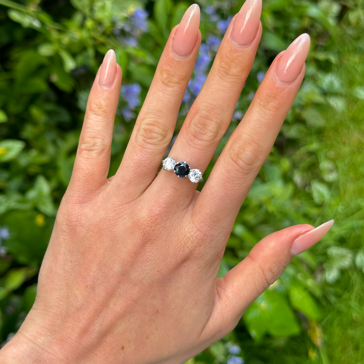 Vintage, 1980s Blue and White Sapphire Three-Stone Engagement Ring, 9ct White Gold worn on hand.