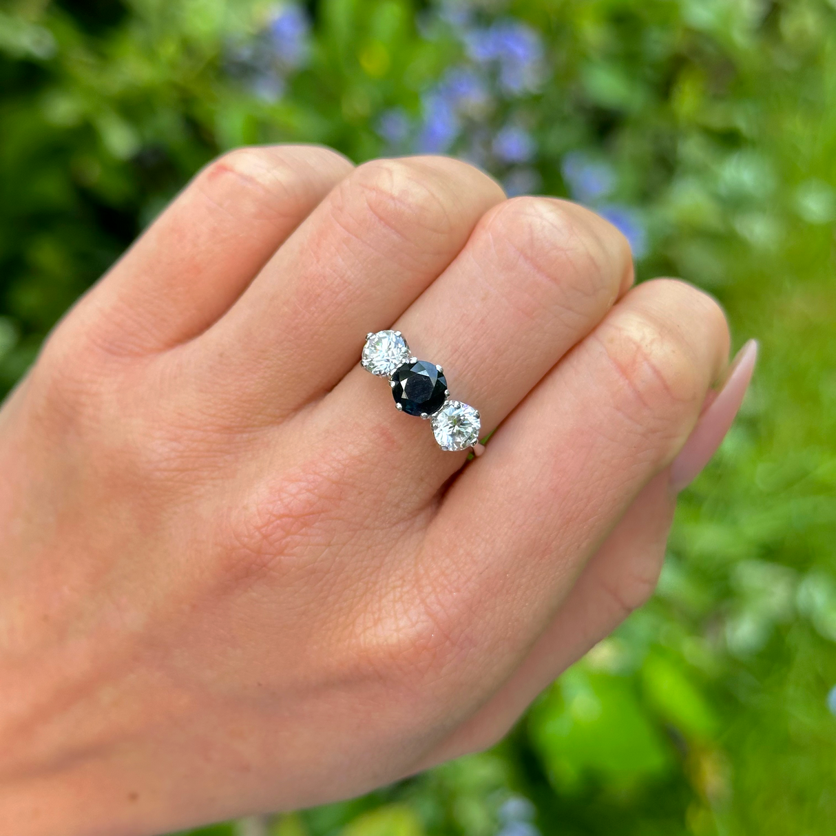 Vintage, 1980s Blue and White Sapphire Three-Stone Engagement Ring, 9ct White Gold worn on hand.