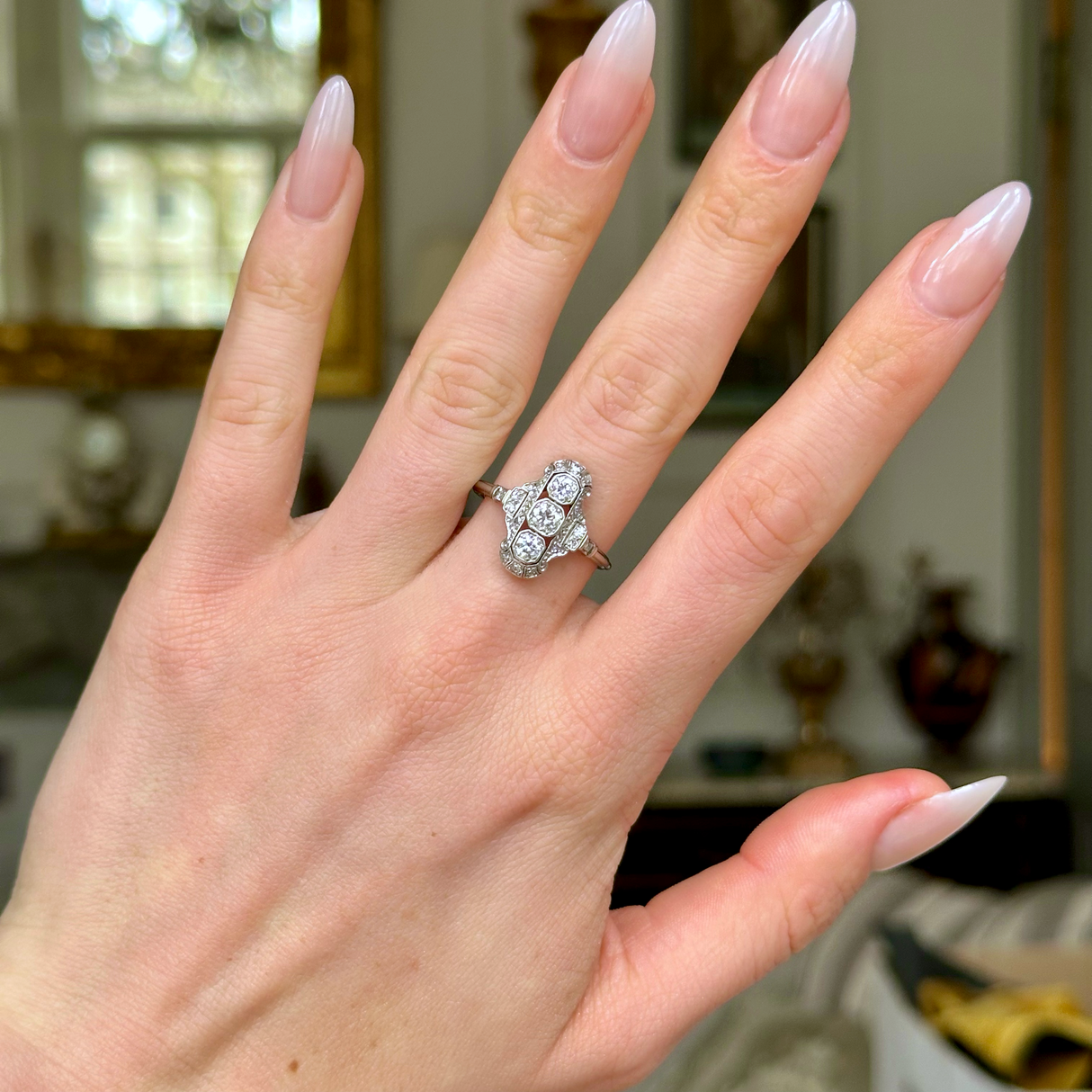 Vintage, Art Deco Three Stone Diamond Panel Ring, 18ct White Gold worn on hand, front view.