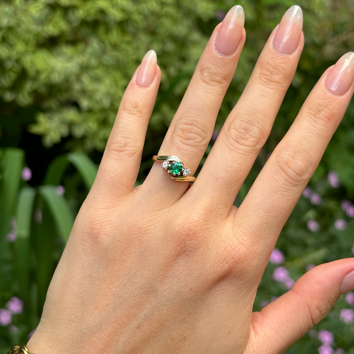 Vintage, Art Deco emerald & diamond three-stone ring, 9ct yellow gold worn on hand.