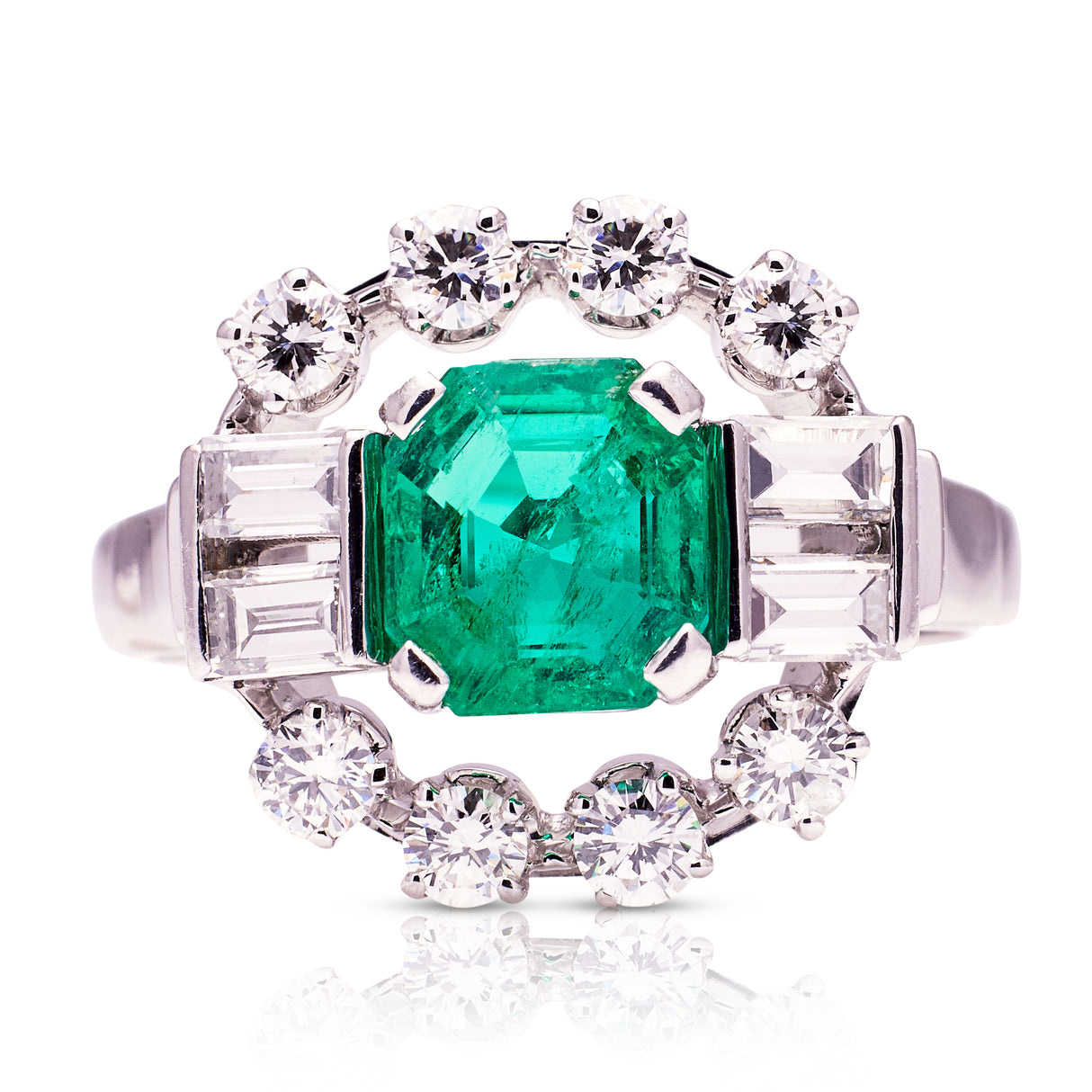 Vintage emerald and diamond cluster ring, front view.