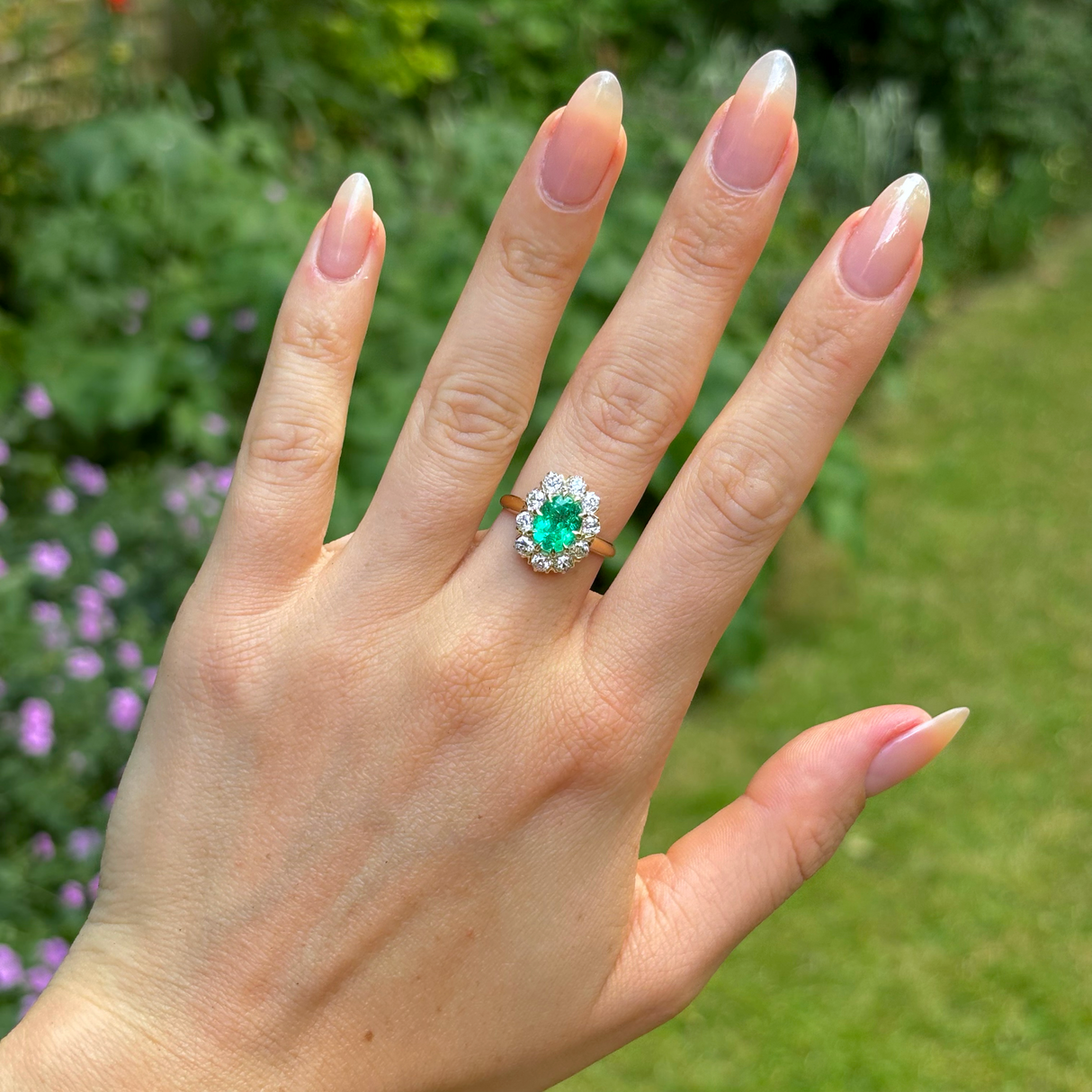 Vintage, Emerald and diamond cluster ring, 18ct yellow gold worn on hand