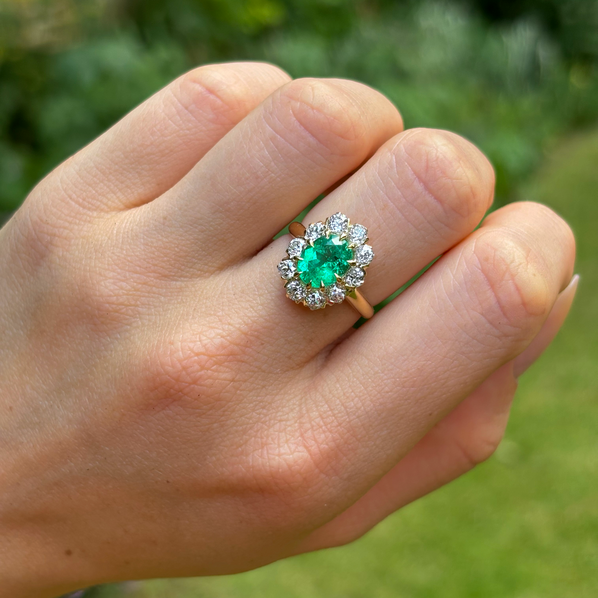 Vintage, Emerald and diamond cluster ring, 18ct yellow gold worn on hand