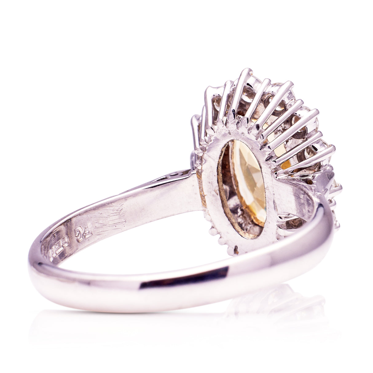 Yellow sapphire and diamond cluster engagement ring, rear view.