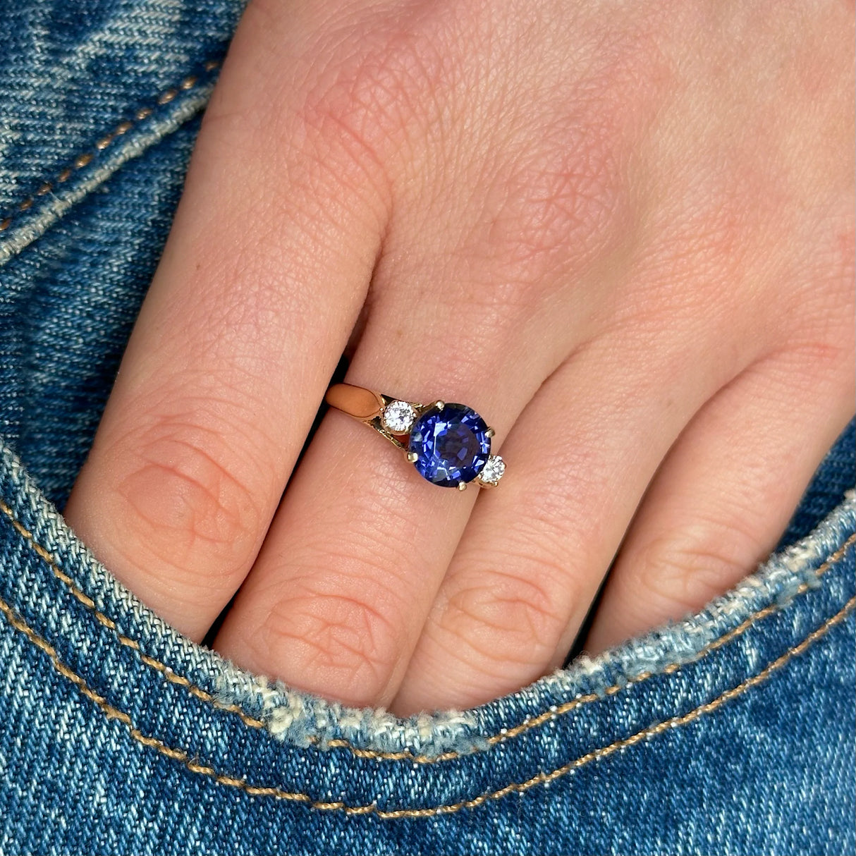 Vintage iolite and diamond three-stone engagement ring, 18ct yellow gold on hand