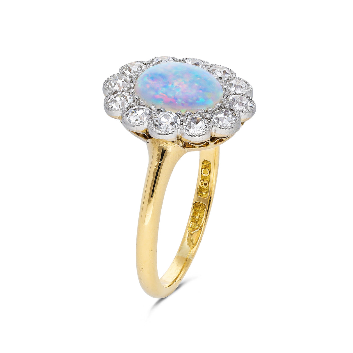 Opal and diamond cluster ring, side view.
