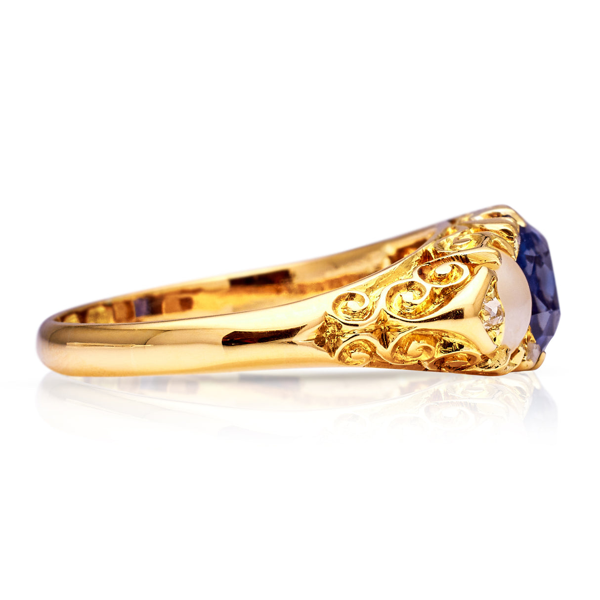Vintage sapphire and pearl ring, side view.