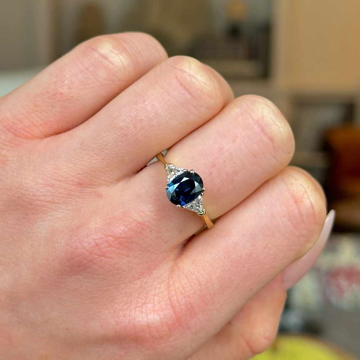 Vintage, Sapphire and Diamond Three-Stone Engagement Ring, 18ct Yellow and White Gold worn on closed hand.