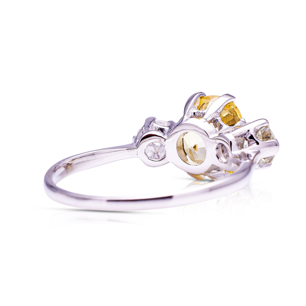 yellow sapphire and diamond three stone engagement ring, rear view.