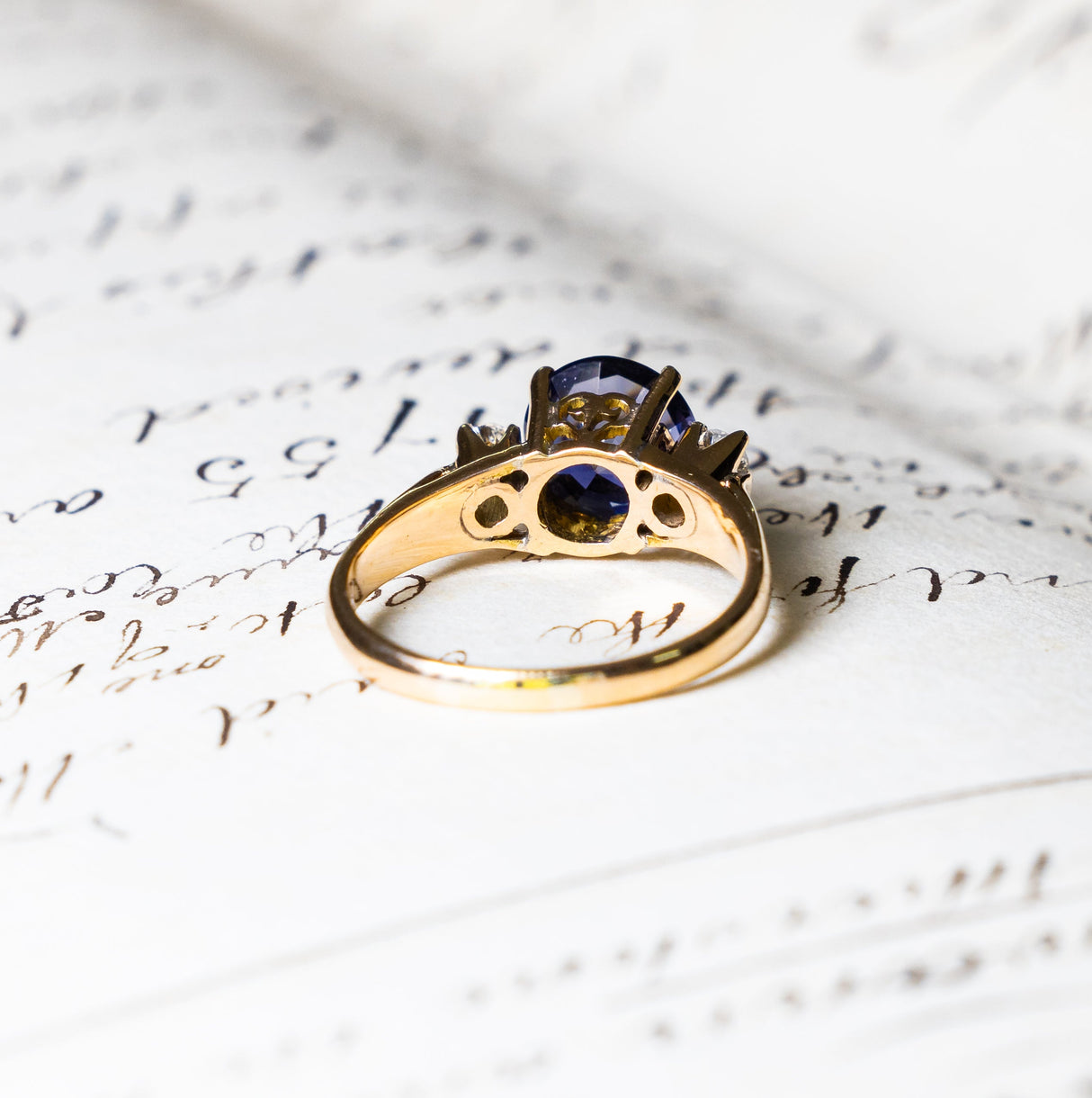 Vintage iolite and diamond three-stone engagement ring