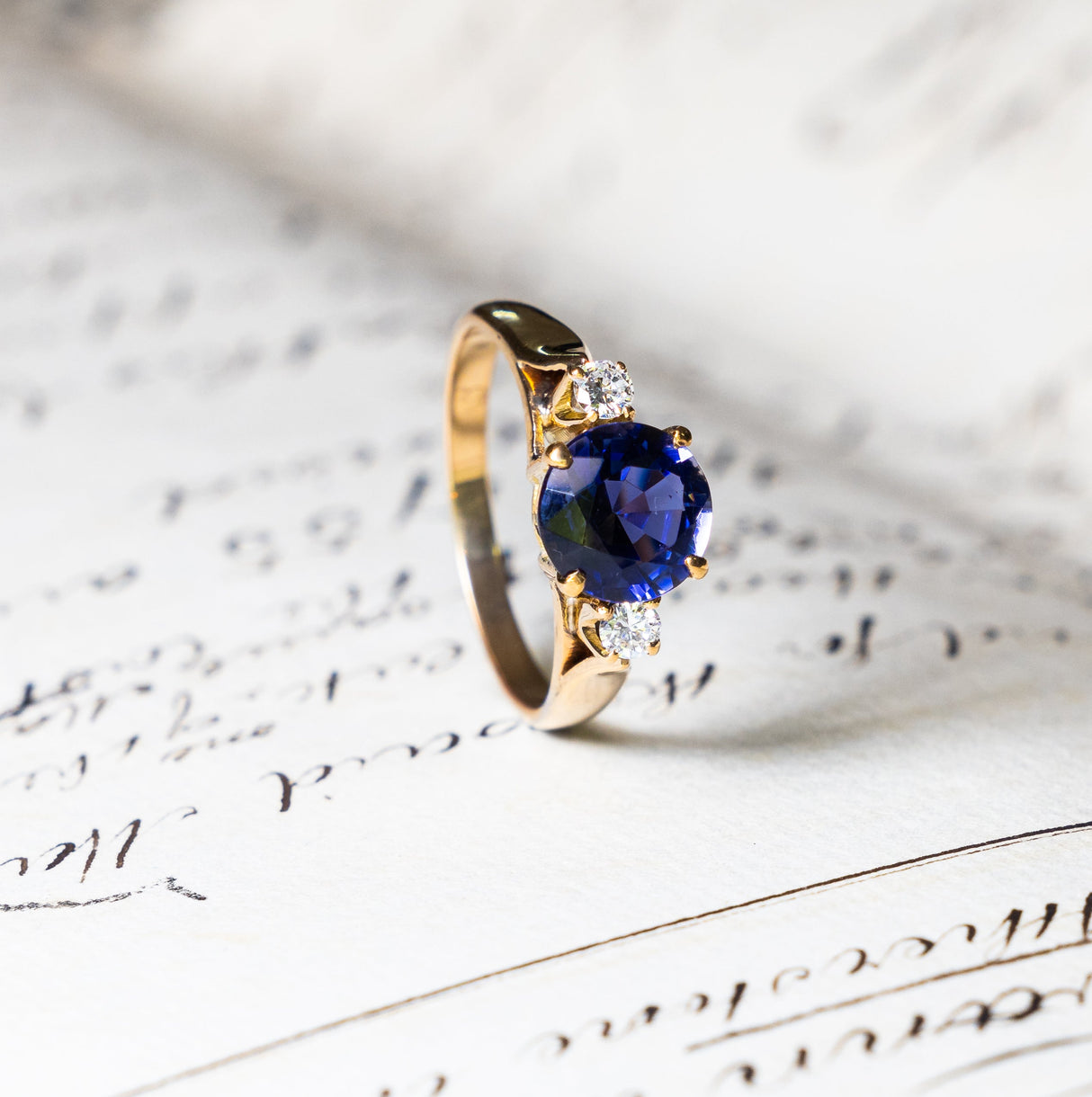Vintage iolite and diamond three-stone engagement ring