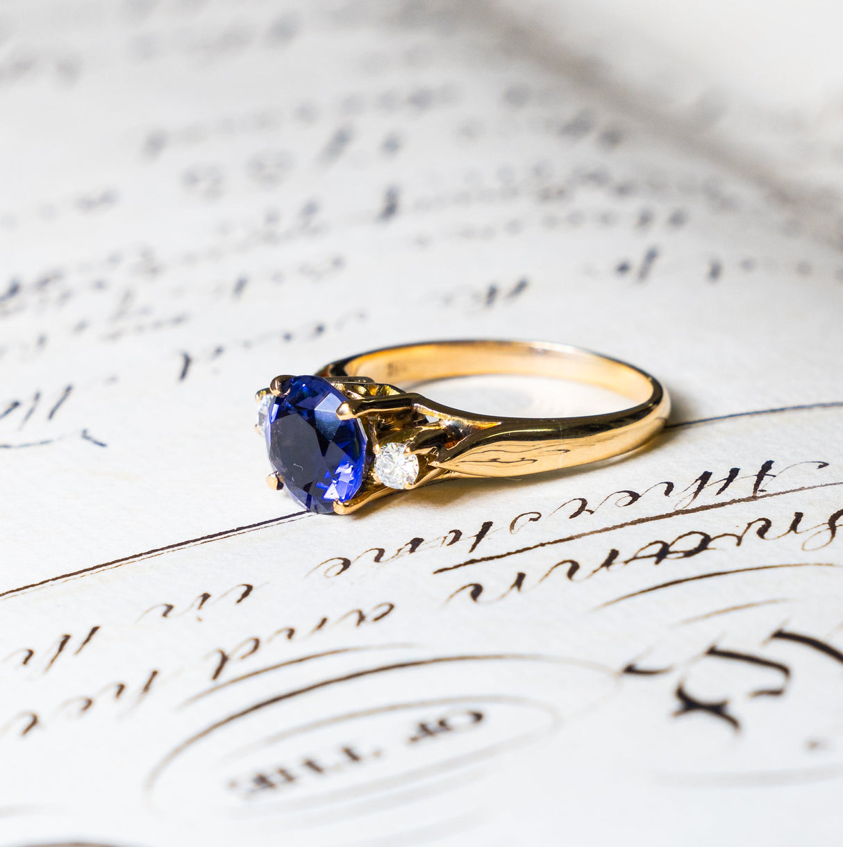 Vintage iolite and diamond three-stone engagement ring