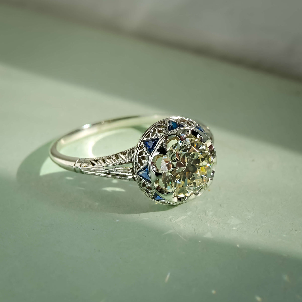 antique art deco diamond and sapphire cluster ring in white gold
