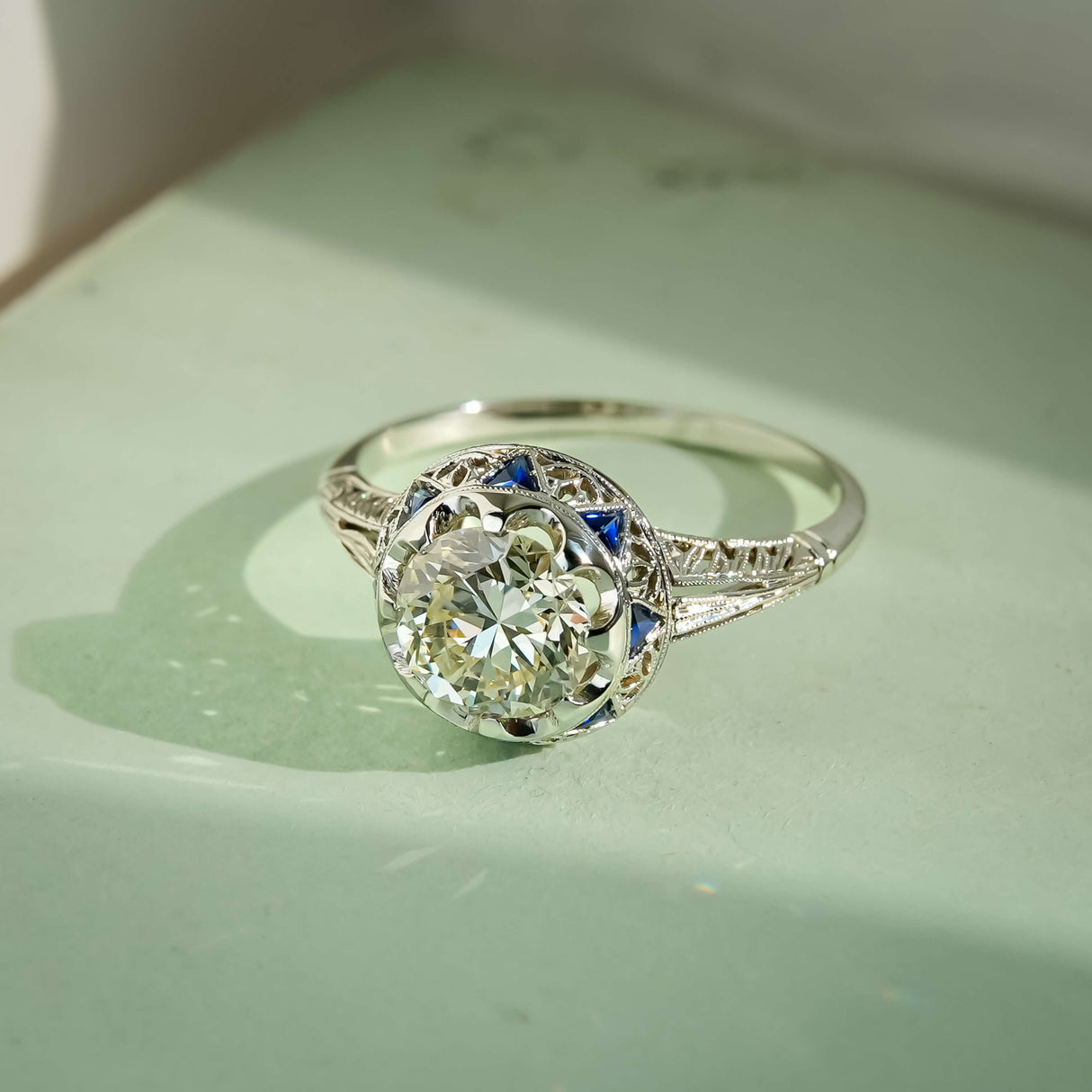 antique diamond sapphire cluster ring with art deco style in white gold