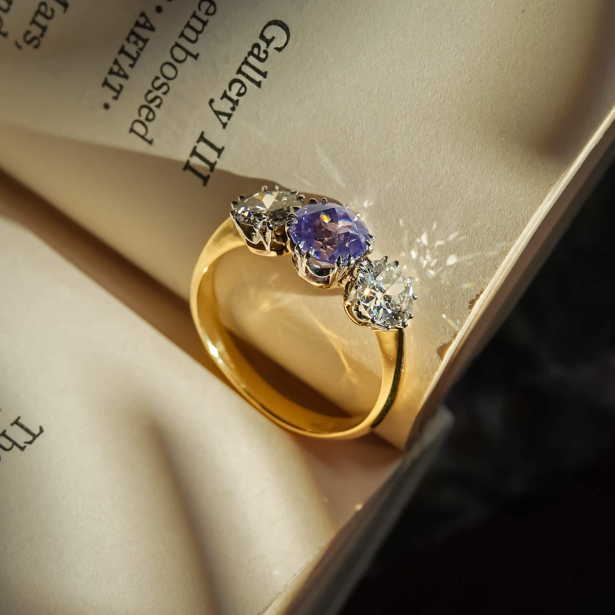 Edwardian sapphire center stone with diamond side stones engagement ring