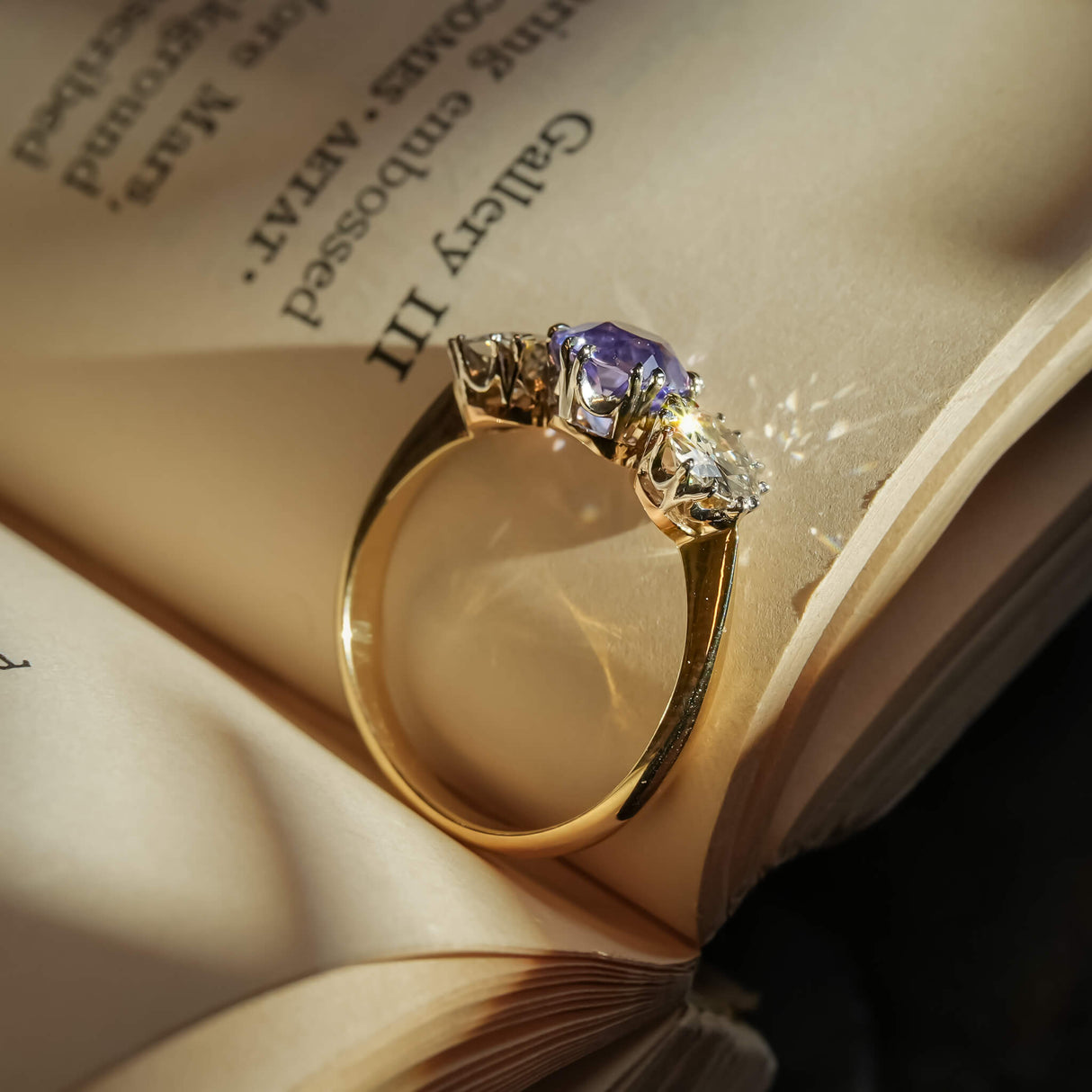 Antique Edwardian sapphire and diamond three stone engagement ring in yellow gold