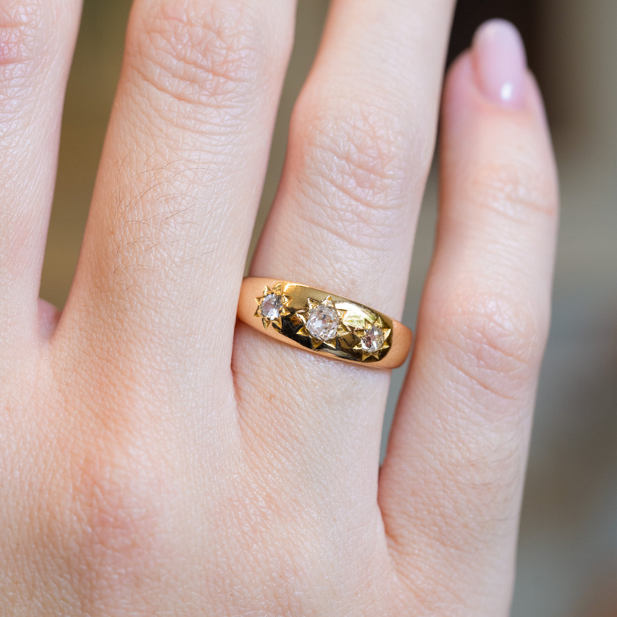 Close up of antique Edwardian gypsy ring with old-mine cut diamonds.