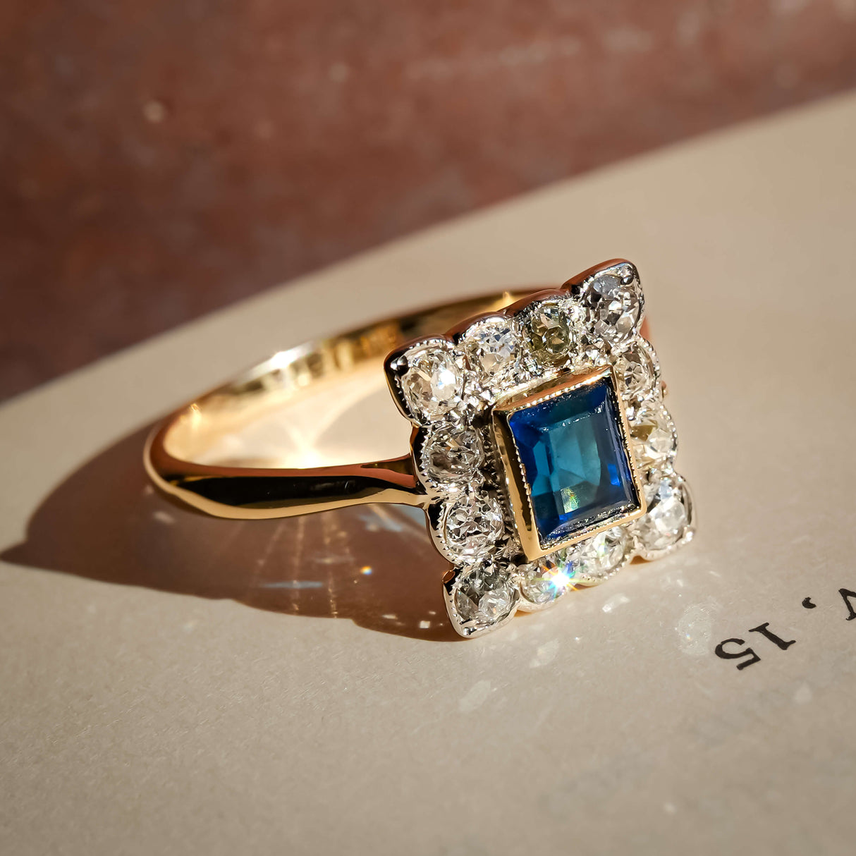 antique sapphire diamond cluster ring with art deco design in yellow gold