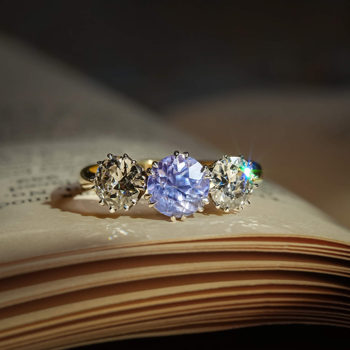 Antique sapphire engagement ring with two diamonds in three stone setting