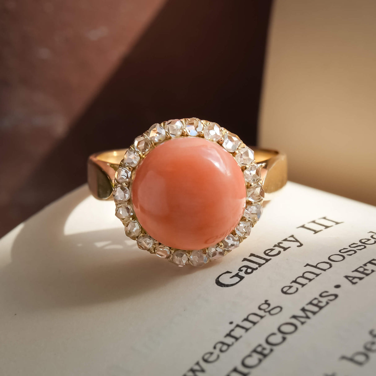 Antique Victorian angel skin coral ring with diamond cluster setting