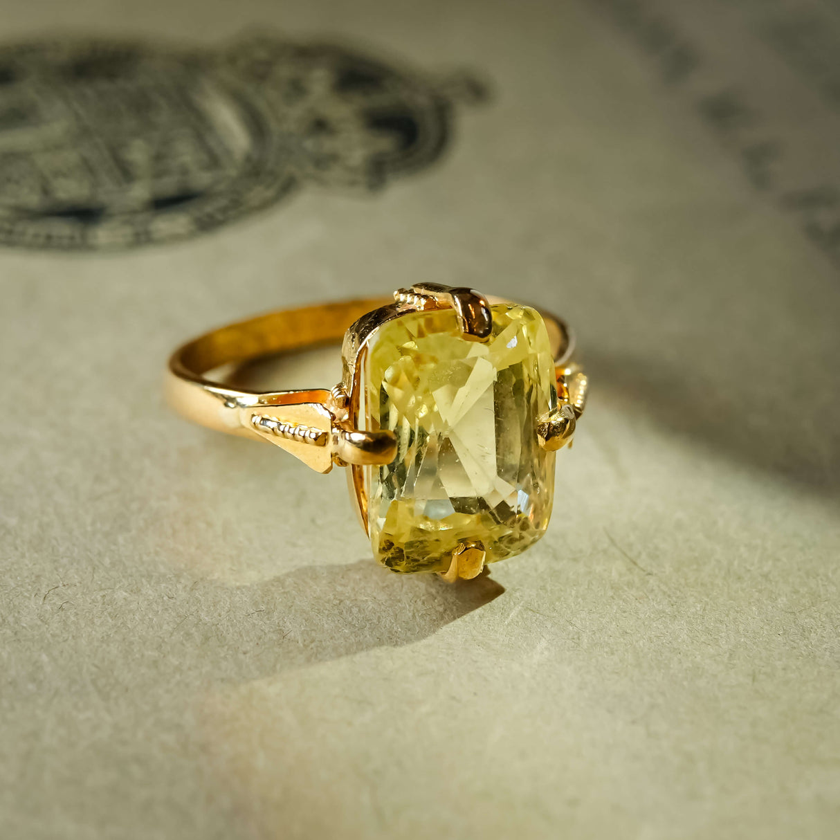 Antique cushion cut yellow sapphire solitaire ring in yellow gold