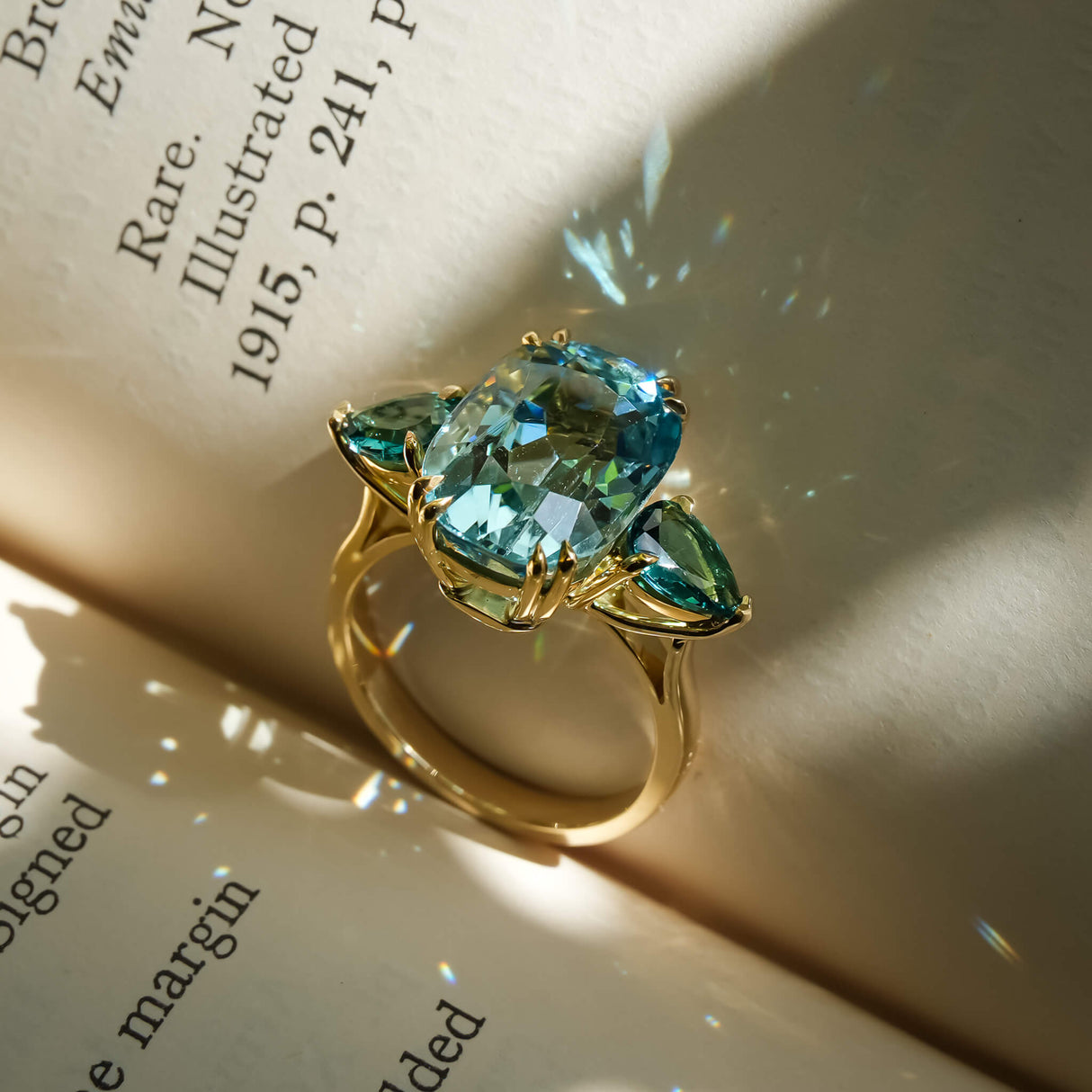 Three stone cocktail ring with aquamarine and sea green tourmaline in gold