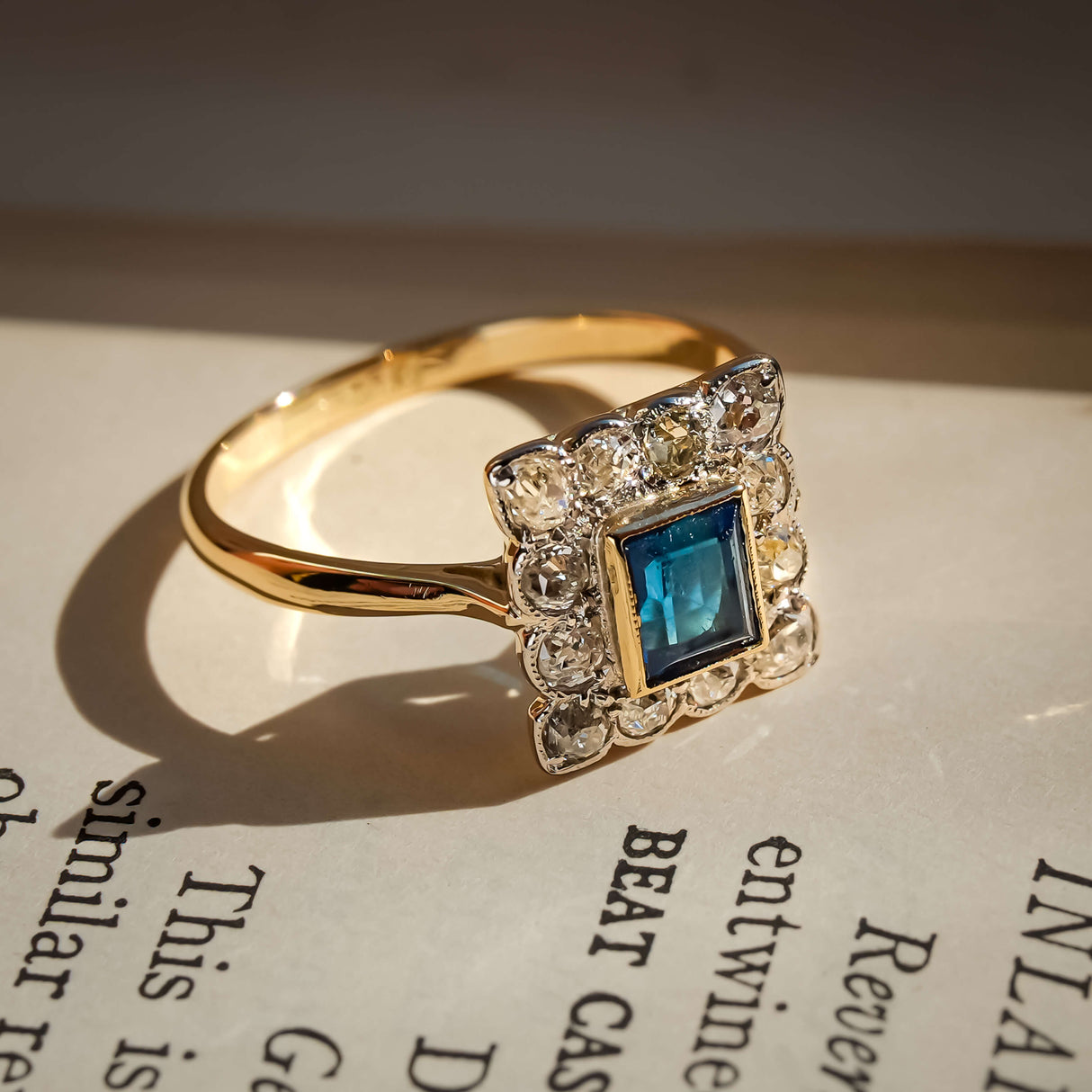 art deco sapphire diamond cluster ring with square halo in yellow gold