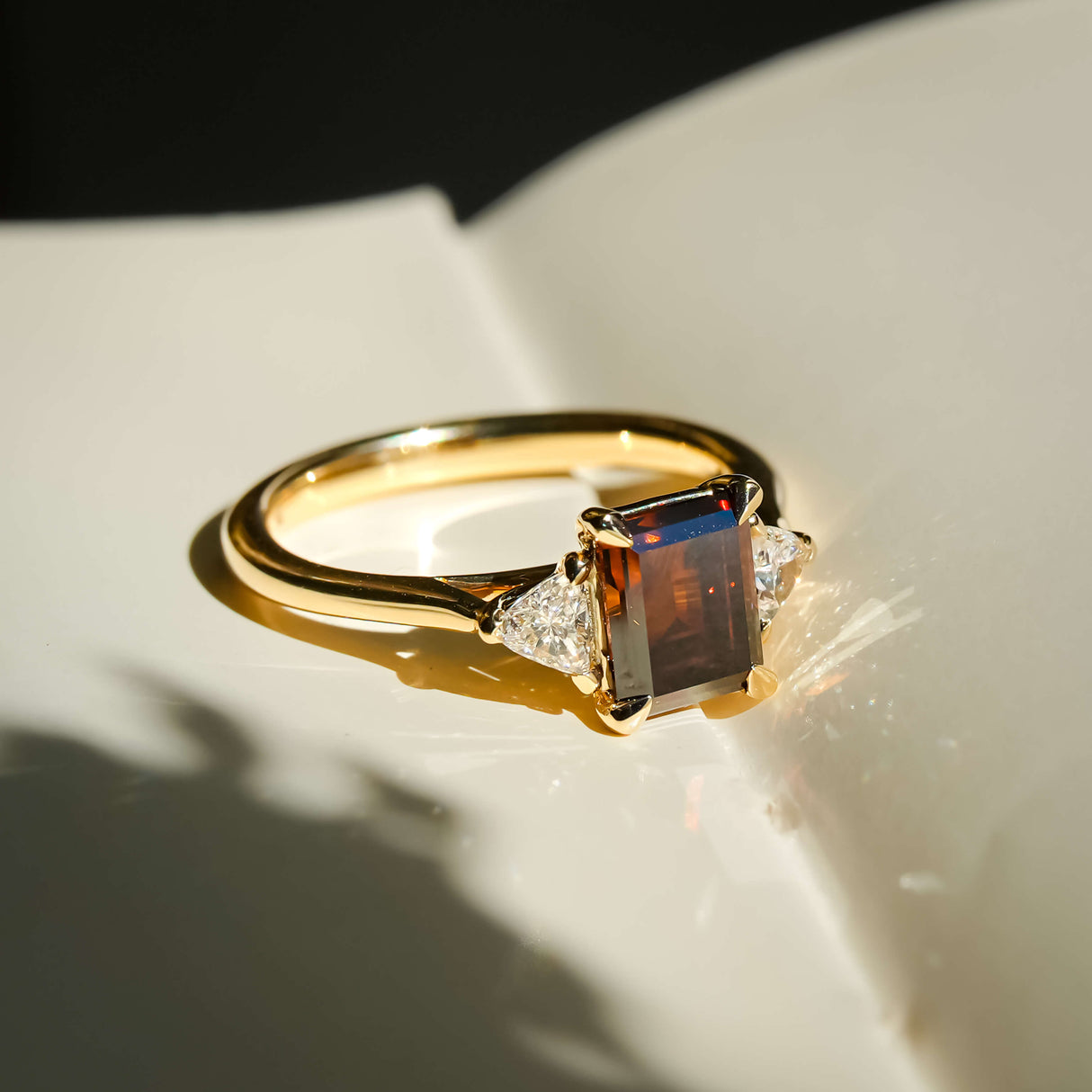 brown diamond engagement ring three stone design with yellow gold band
