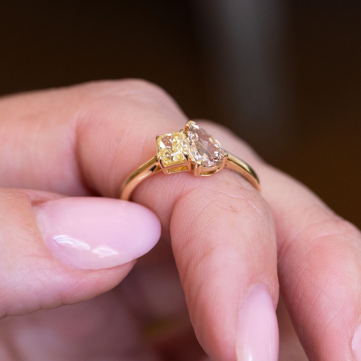 Brown and yellow diamond Toi et Moi engagement ring with pear-cut brown diamond and yellow diamond pairing.