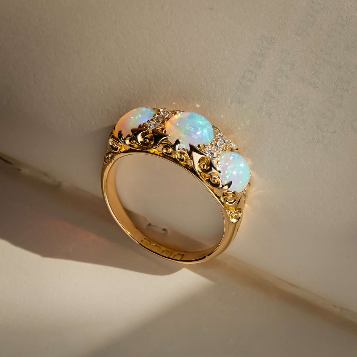 edwardian opal and diamond three stone ring with yellow gold band