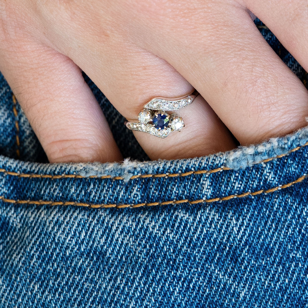 Edwardian sapphire twist ring with diamonds styled with denim