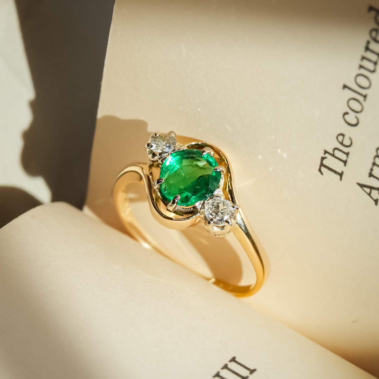 Emerald and diamond three stone ring from the Edwardian period