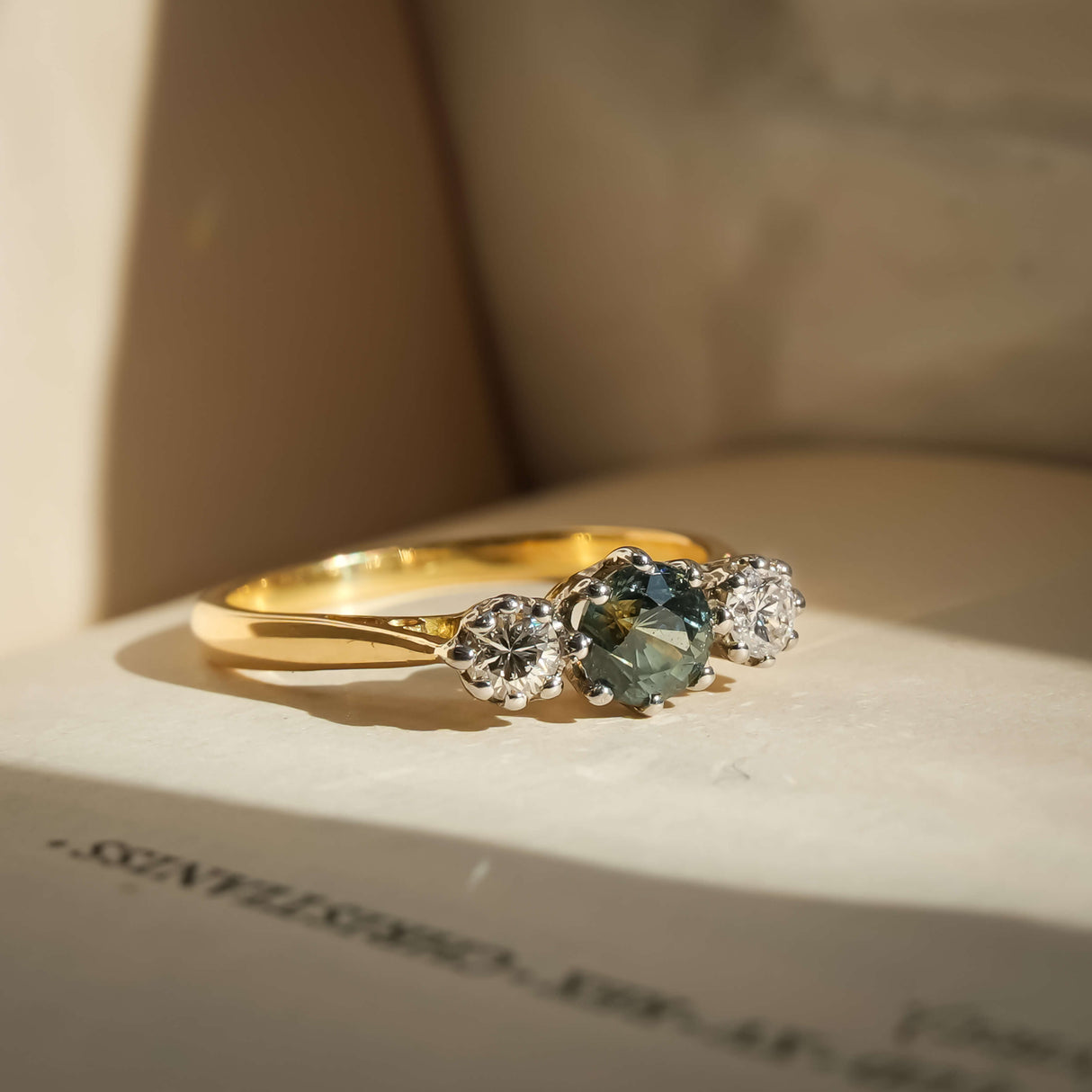 green sapphire three stone diamond ring with vintage 1950s design in yellow gold
