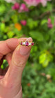 Antique, Edwardian Five Stone Ruby and Diamond Ring, 18ct Yellow Gold held in fingers.