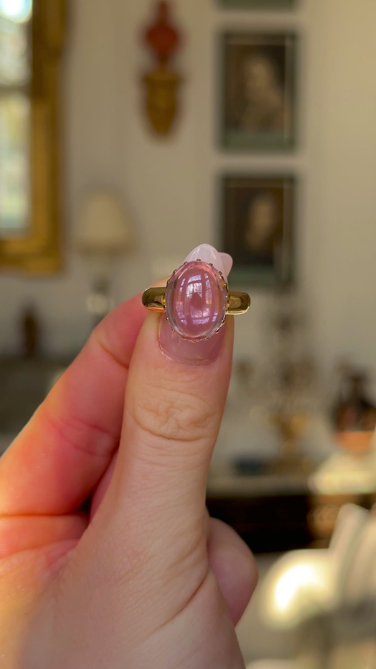 Vintage, Pale Pink Cabochon Topaz Ring, 18ct Yellow Gold held in fingers and moved around to give perspective.