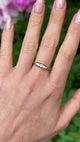 Antique, Edwardian Five-Stone Diamond Ring, 18ct Yellow Gold held in fingers.