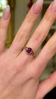 Vintage single-stone ruby and yellow gold ring, worn on hand and moved around to give perspective.