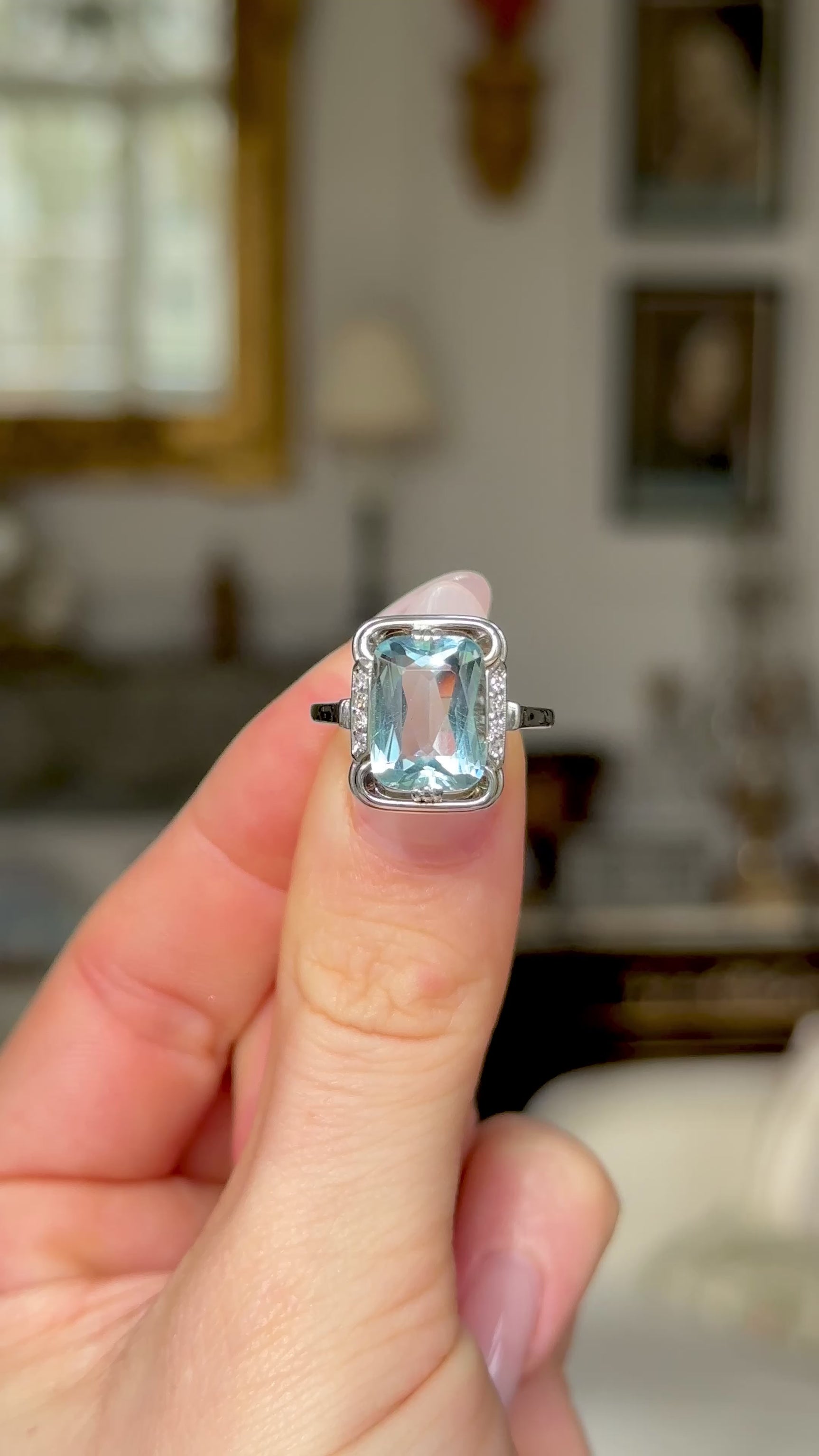 Vintage, Aquamarine and Diamond Ring, 18ct White Gold held in fingers and moved around to give perspective.