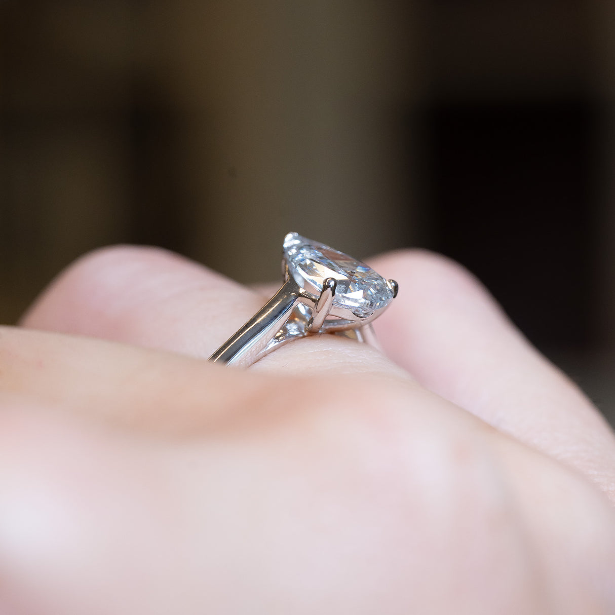 Vintage 1990s salt and pepper diamond solitaire ring with elevated pear-shaped diamond side profile.