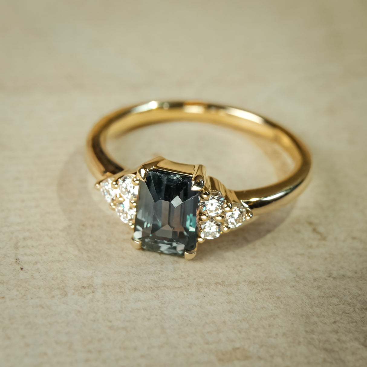 Teal sapphire diamond cluster trefoil ring set in gold