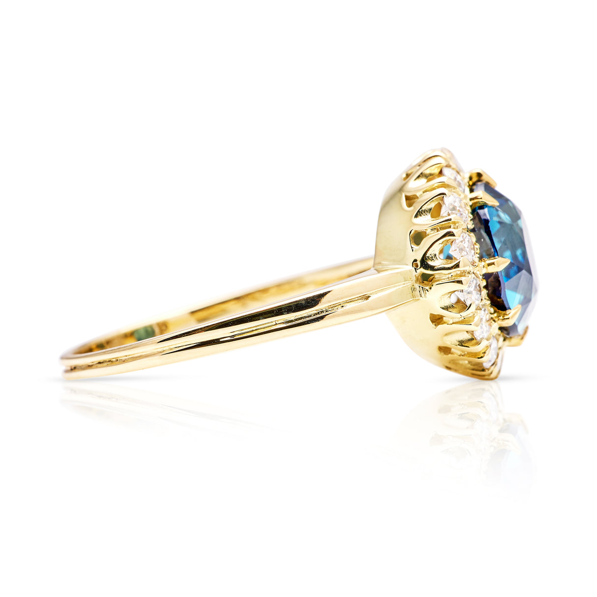 Vintage, teal blue sapphire and diamond cluster ring