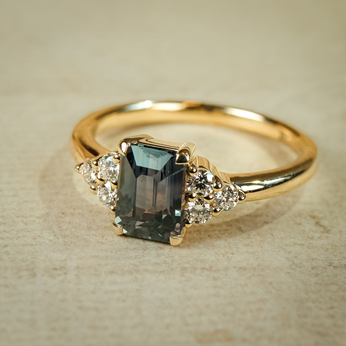 Teal sapphire trefoil diamond engagement ring with gold band