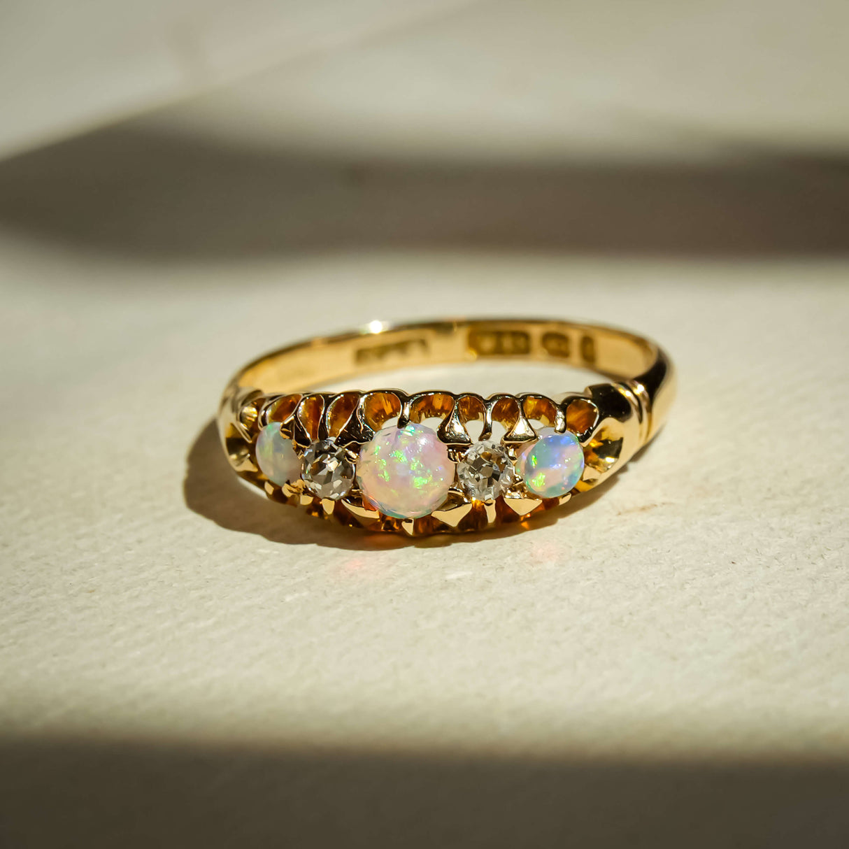 Late Victorian opal and diamond five stone ring with central opal and diamond details