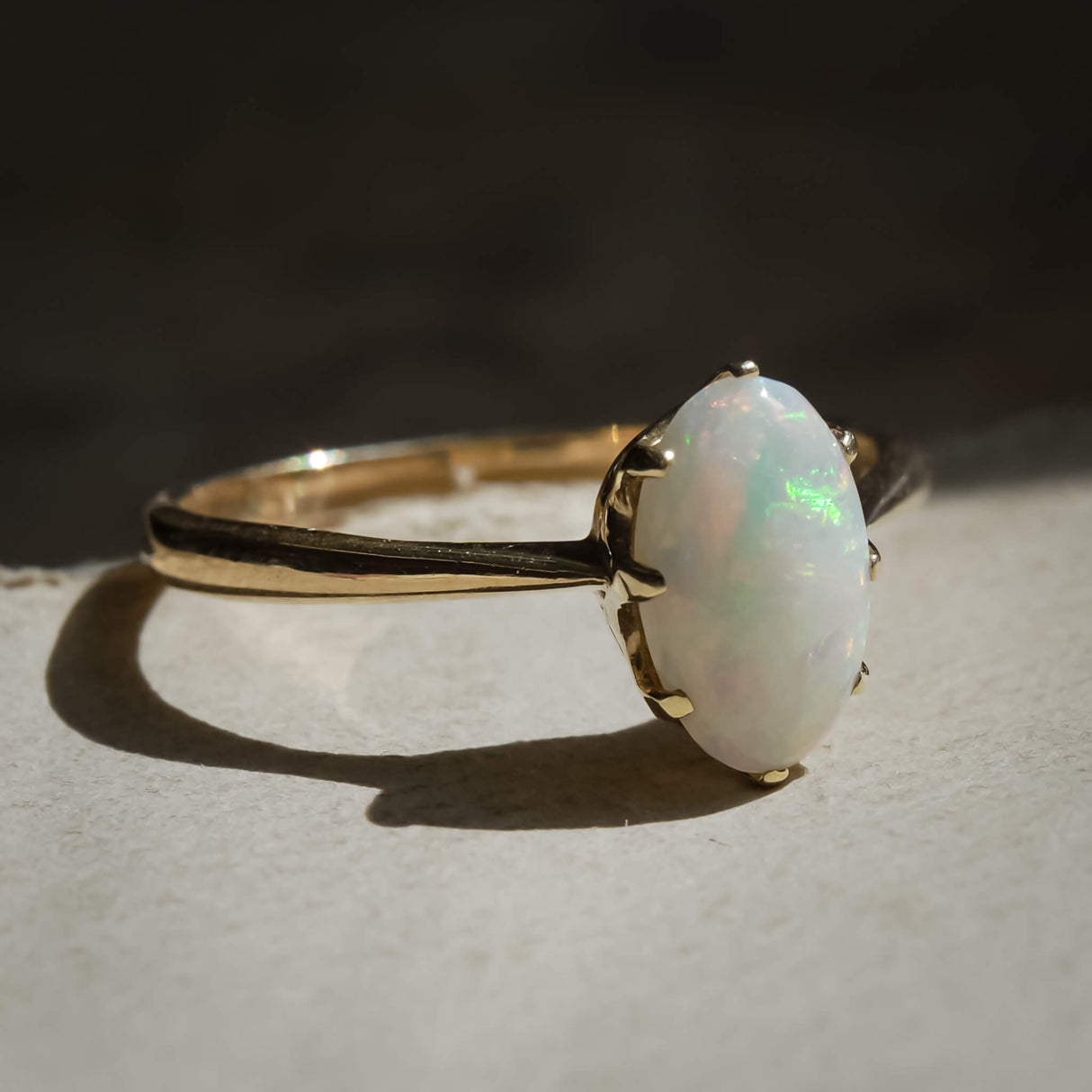 1990s precious opal solitaire ring with oval cabochon in gold