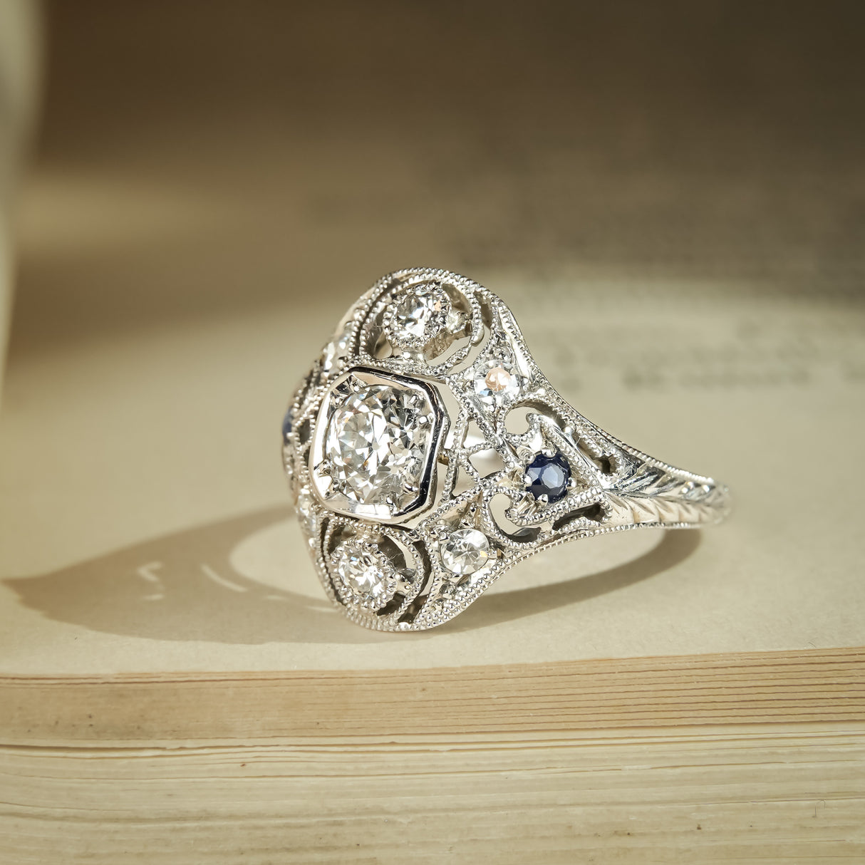 Vintage Art Deco diamond cluster ring with sapphire details