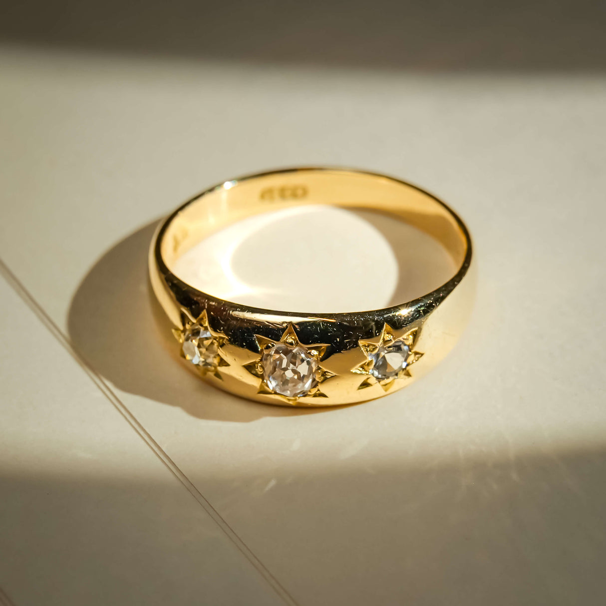 Vintage Edwardian gypsy ring with old mine cut diamonds set in gold band