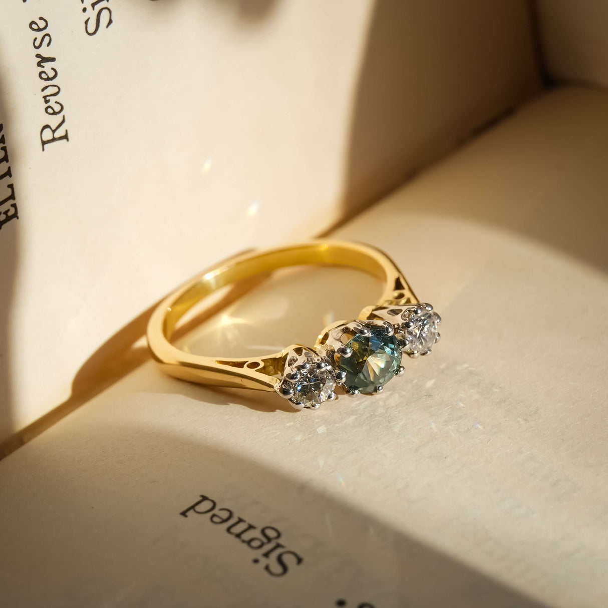 vintage green sapphire diamond three stone engagement ring from the 1950s