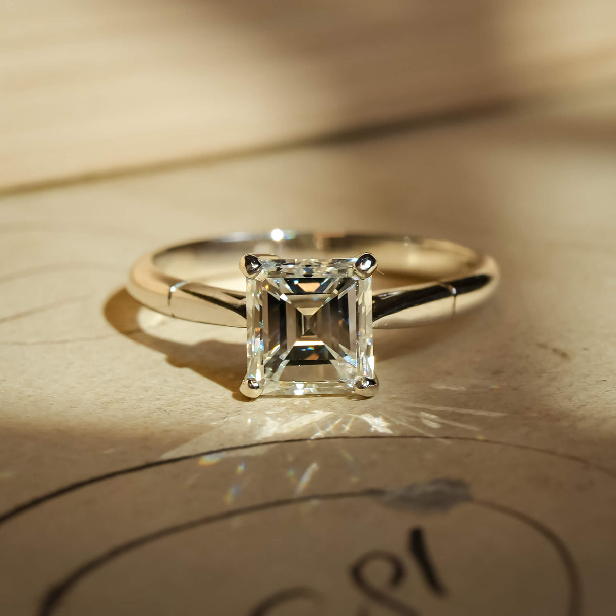 Vintage solitaire diamond ring from the 1980s with platinum band