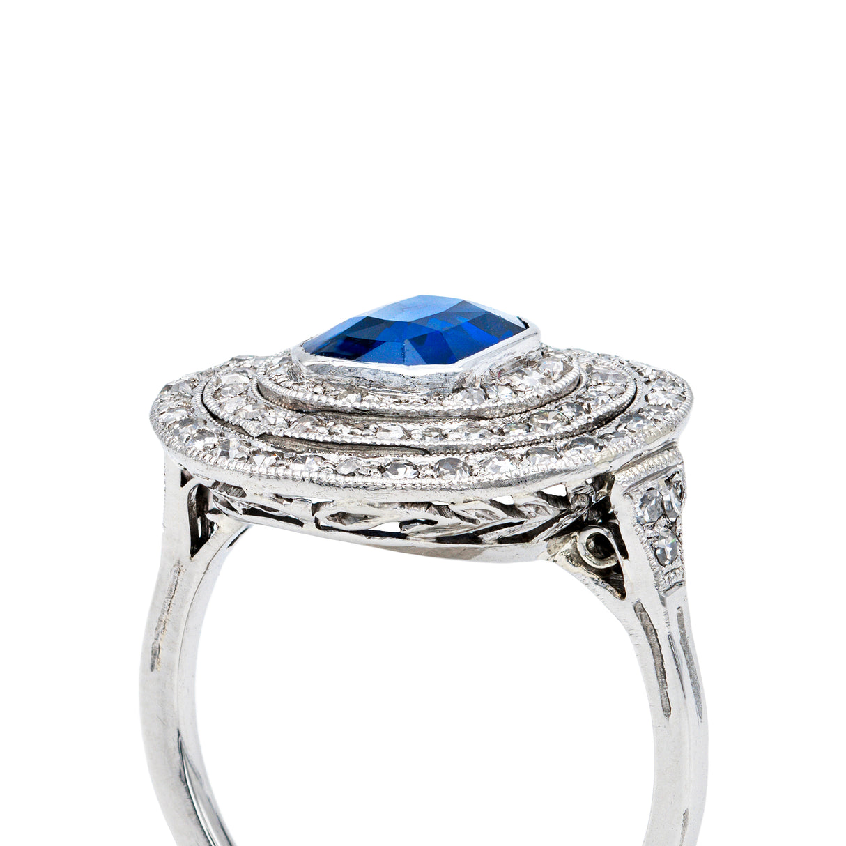 Sapphire and diamond target cluster ring, side view.