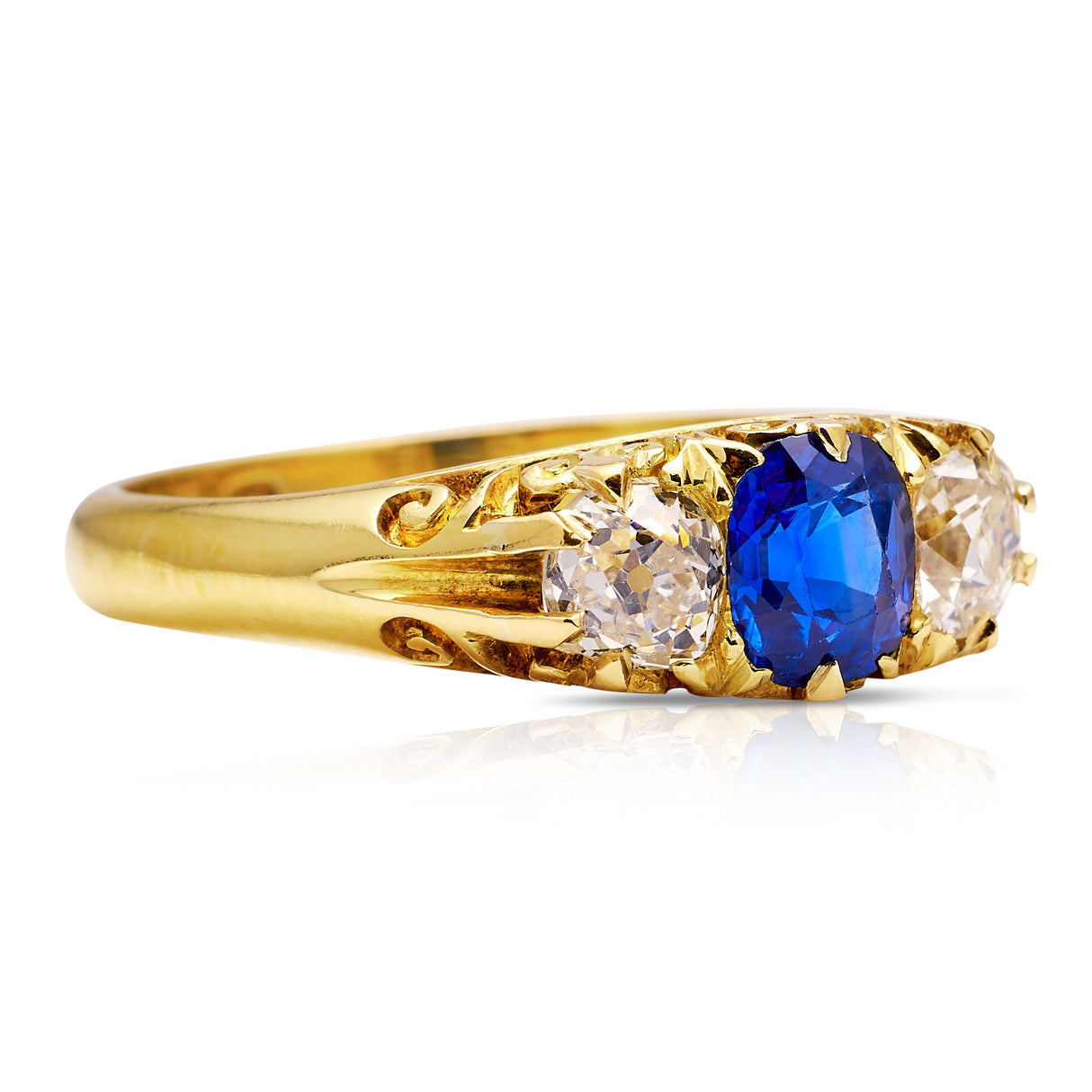 Sapphire and diamond three stone ring, side view.